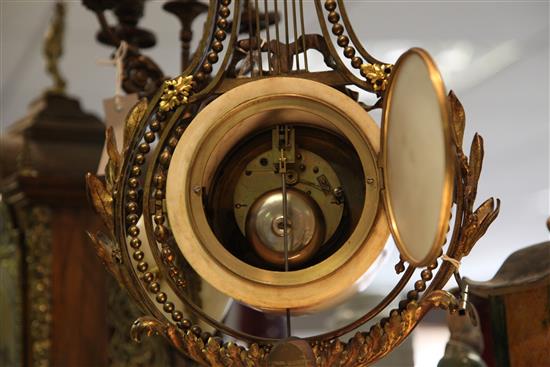 A 19th century French ormolu mounted white marble clock garniture, 21in.